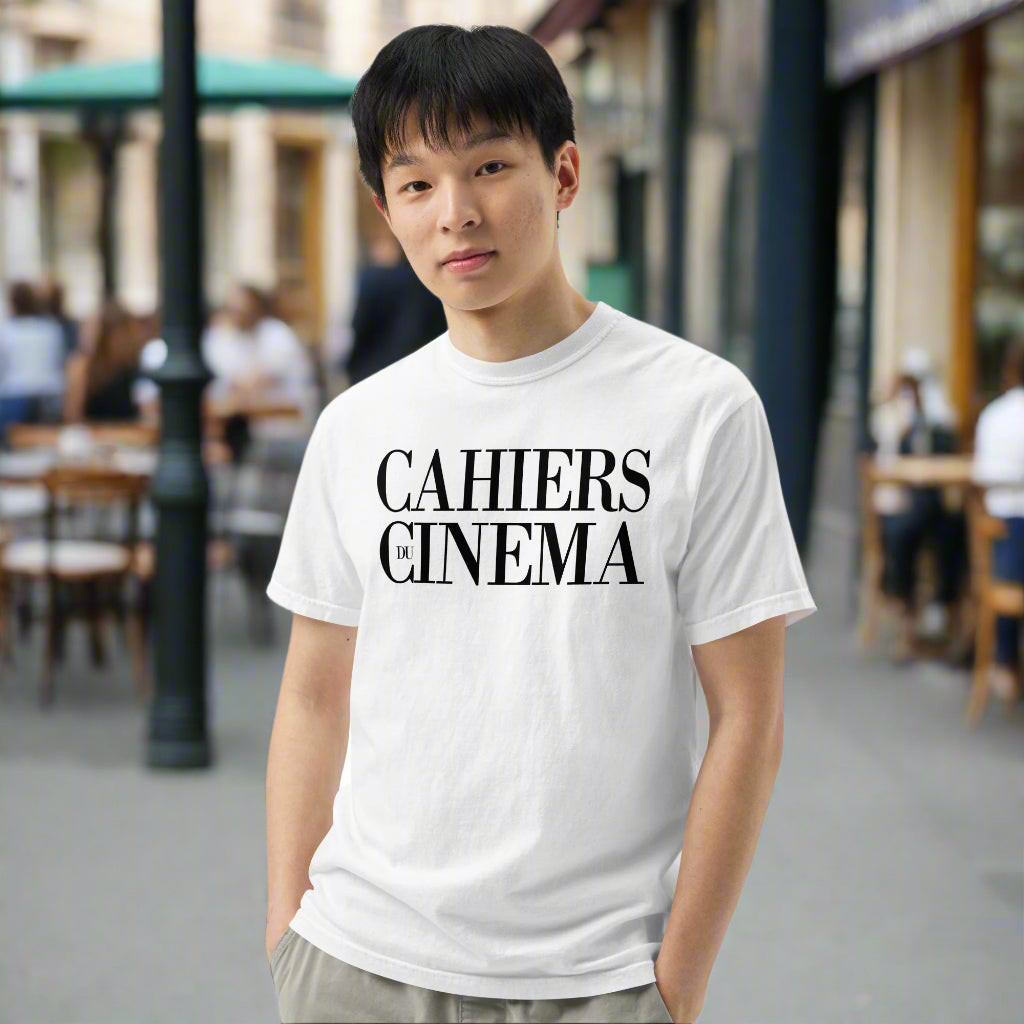 Person wearing a white t-shirt with 'CAHIERS DU CINEMA' text on a white background
